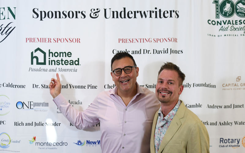 party guest pose in front of the step and repeat at the 2025 CAS Garden Party