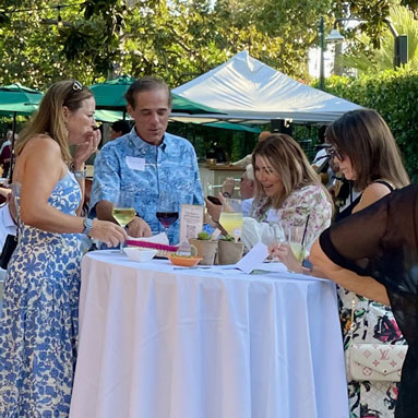Guests sharing a laugh over drinks